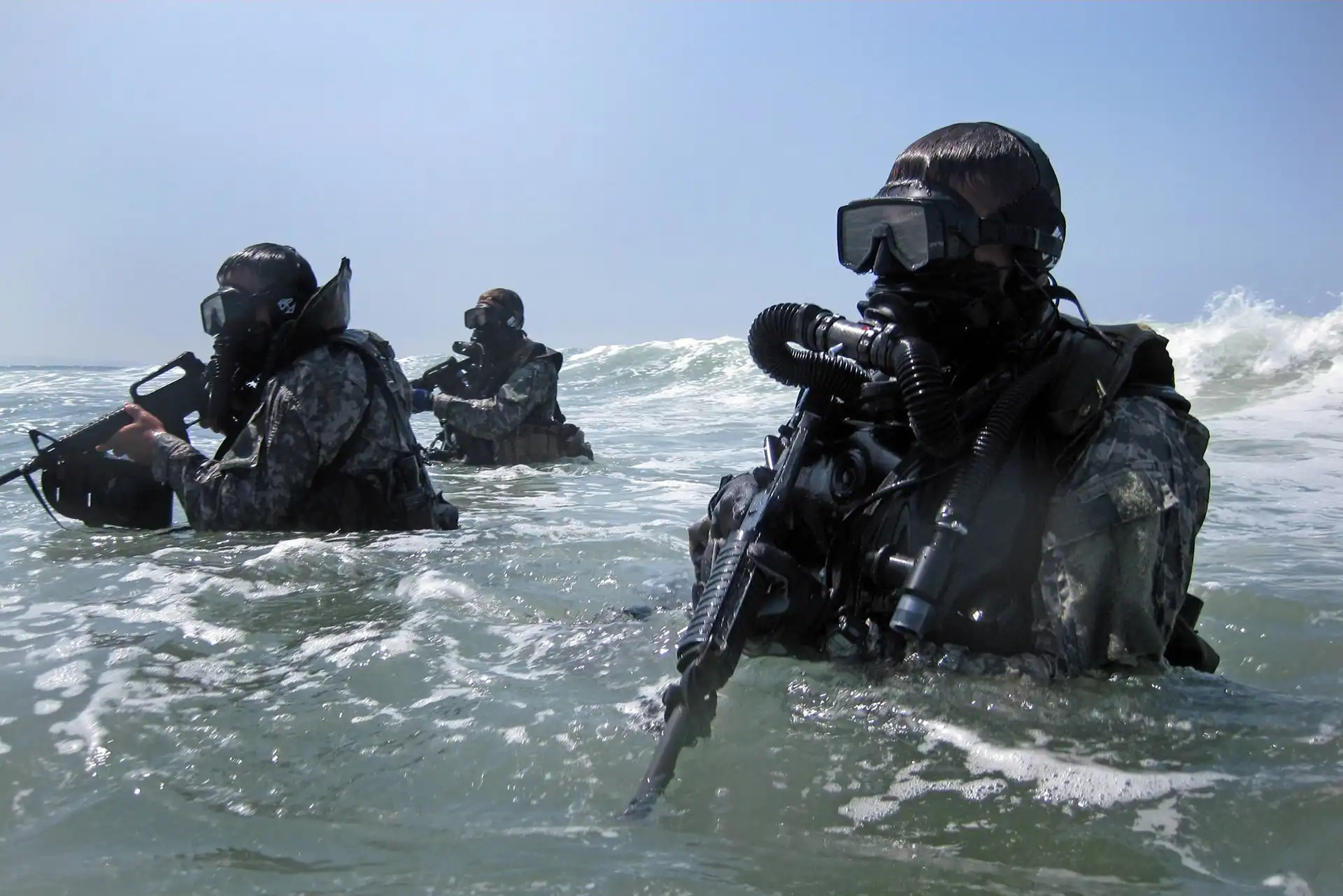 Special forces combat divers emerging from the surf